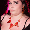 Sugar & Vice Orange Triangle Statement necklace modelled